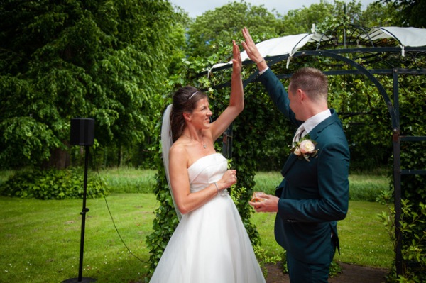 High-five-bride-groom